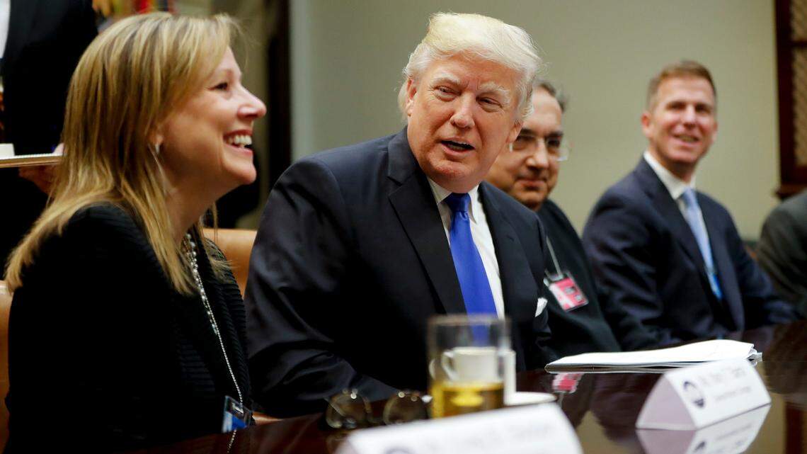 President Donald Trump speaks at the start of a meeting with automobile leaders in the Roosevelt Room of the White House in 2017. At left is General Motors CEO Mary Barra, whose company announced massive job cuts and plant closings on Monday.