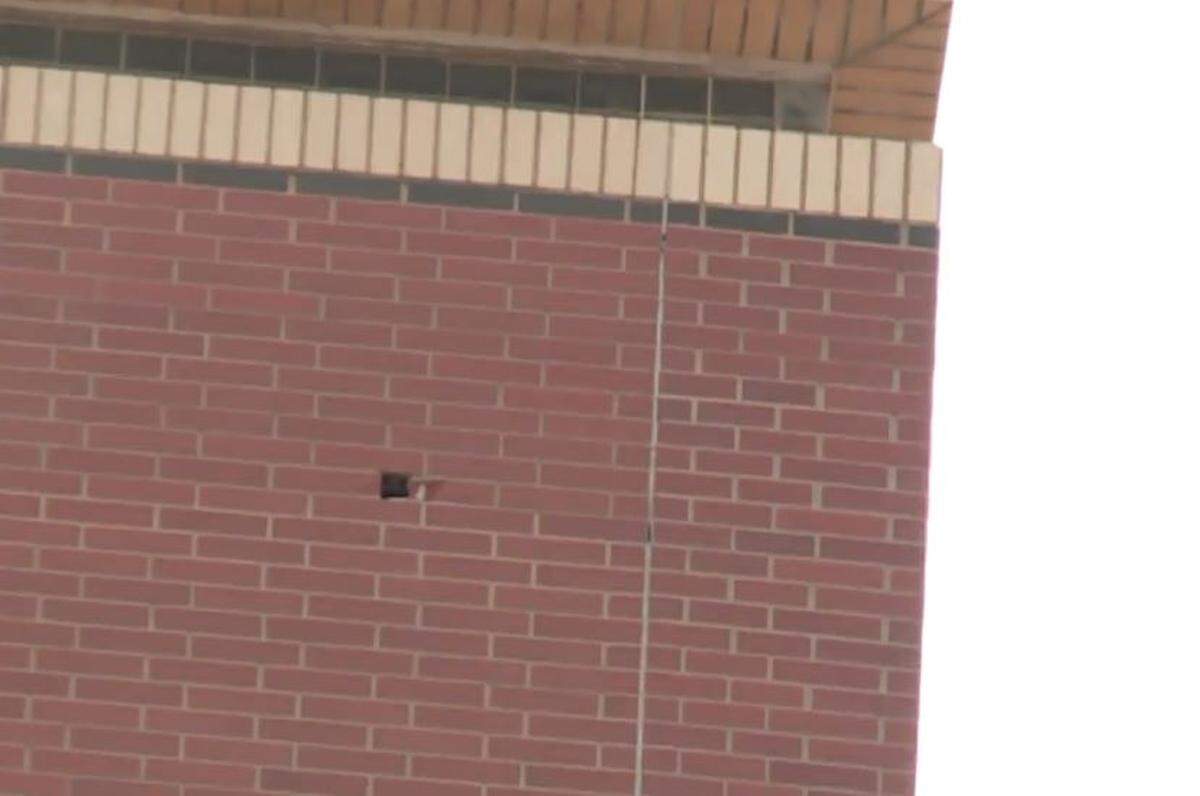 The hole in question, in the wall of the 12th floor of the Oklahoma County Jail.
