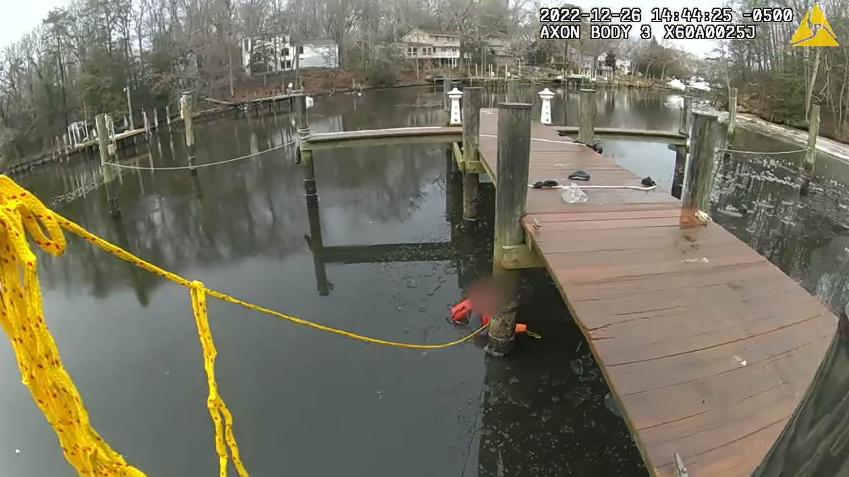 A teenager who jumped into a frozen creek to save his friend was rescued by police, Maryland officials say.