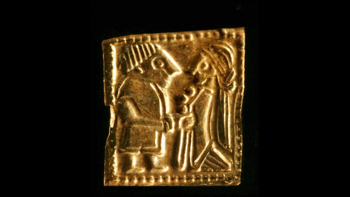 Each gold piece is decorated with an ornately dressed and accessorized man and woman, experts said.