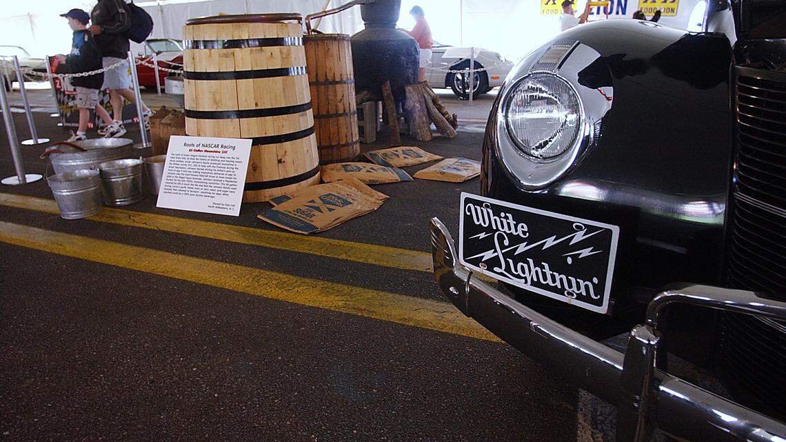 A 2002 display at Charlotte Motor Speedway in Concord, NC featured items associated with driver Junior Johnson and his history with moonshine.