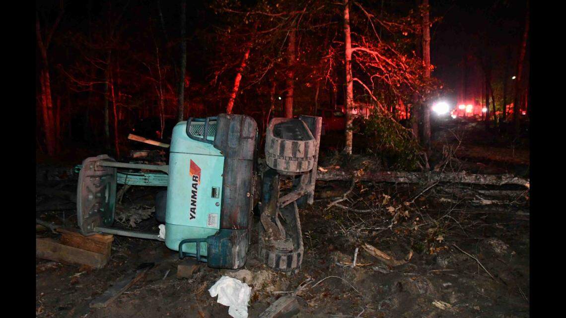 A man’s wife found him dead after he became trapped under a mini-excavator on his property, South Carolina firefighters said.