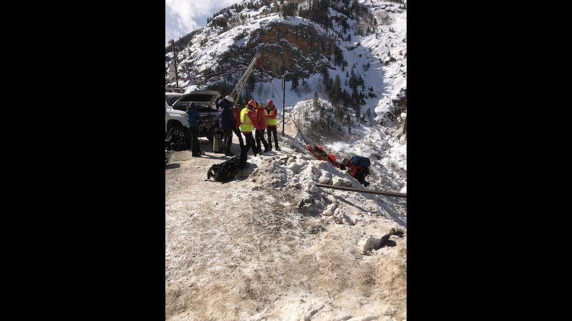 A man yelled for help for several hours after his car plunged hundreds of feet off of a cliff into a river, Colorado police say. Photos show the dramatic rescue.