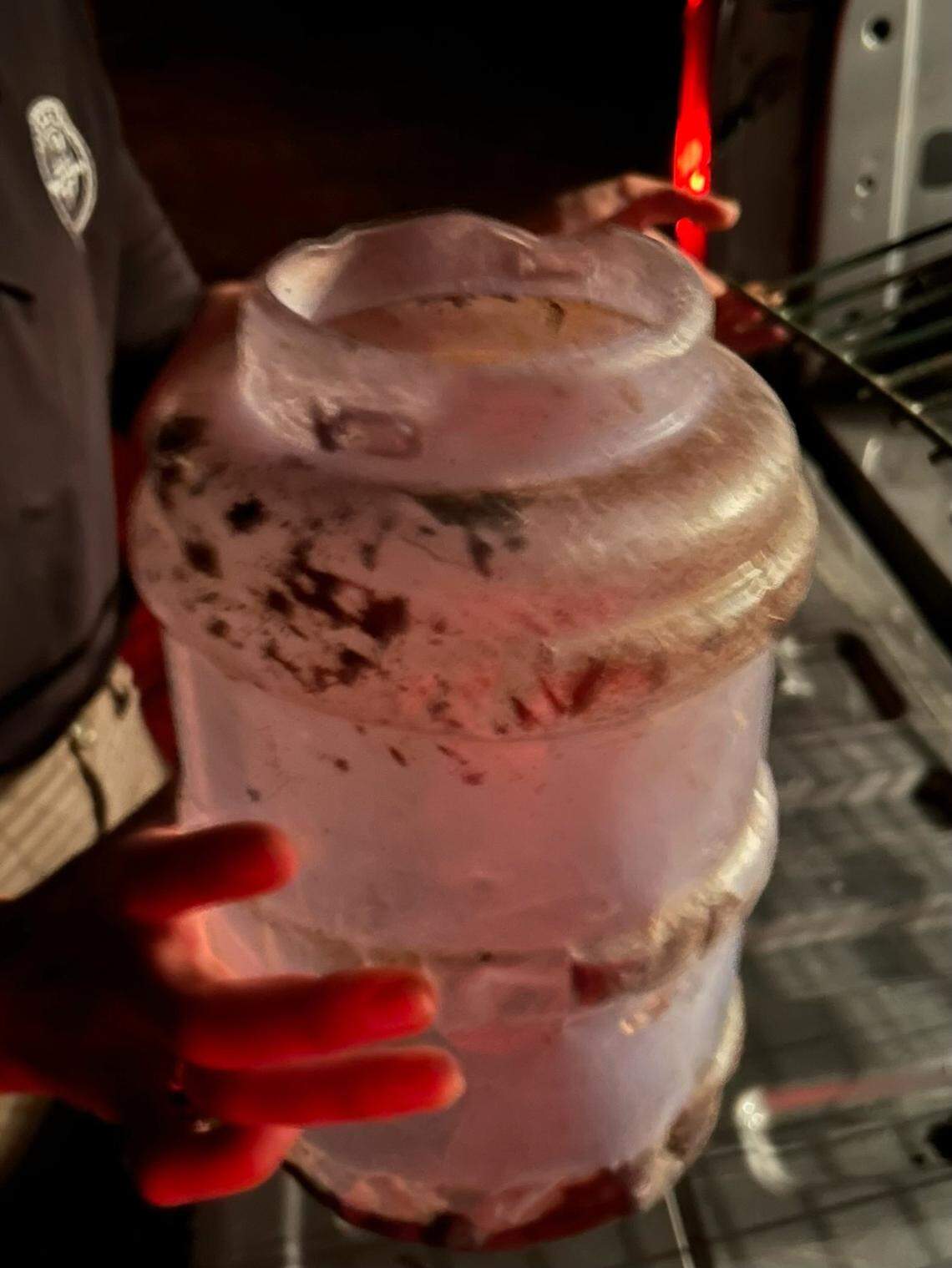 The wildlife official had to cut the feeder off of the cub’s head, she said.