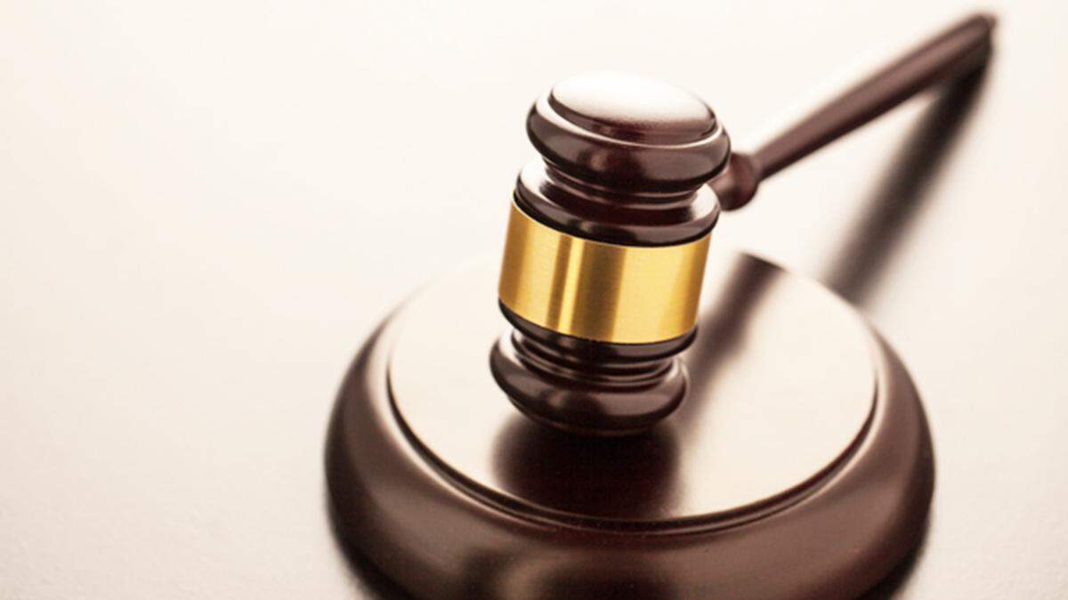 A home health aide was sentenced to 57 months in prison for stealing hundreds of thousands of dollars in U.S. Savings Bonds from the woman she cared for, according to Connecticut officials.