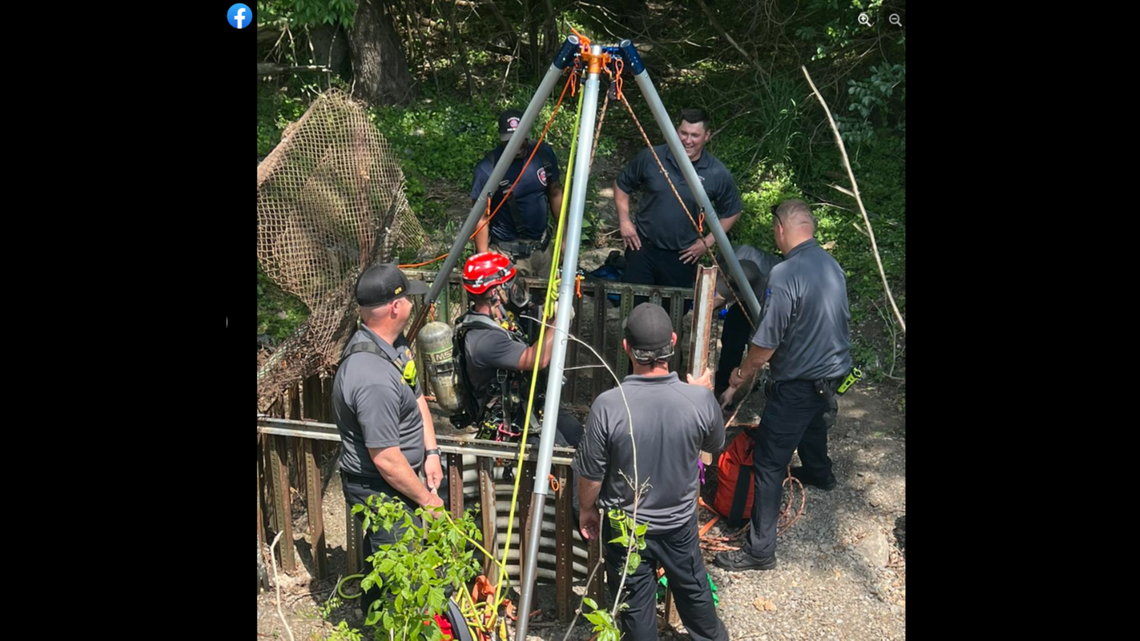 The fire crews used a tripod to lower a firefighter down into the drain.