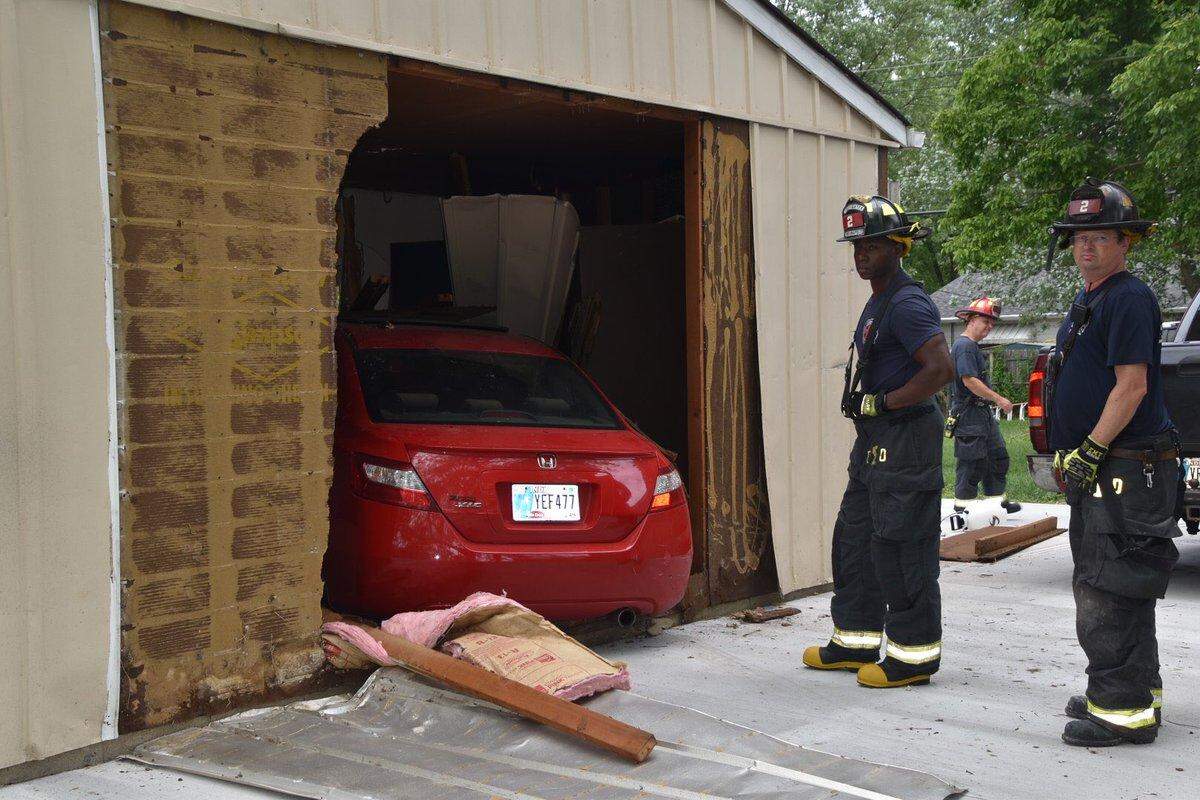 The incident left the siding ripped off the home’s garage, photos show.