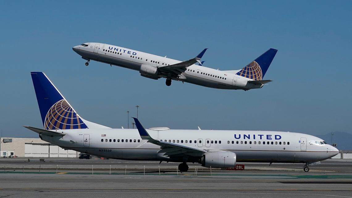 FILE - In this Oct. 15, 2020, file photo, a United Airlines airplane takes off over a plane on the runway at San Francisco International Airport in San Francisco. (AP Photo/Jeff Chiu, File)