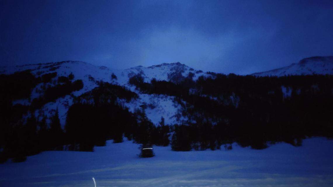 An avalanche carried a snowbiker through a gully and over a waterfall on Saturday, Feb. 19.