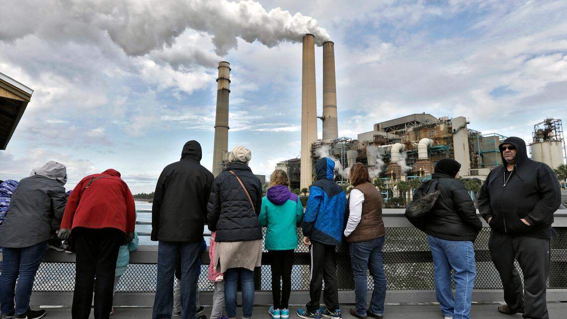 Visitors at the Tampa Electric Company Manatee Viewing Center are bundled up against the cold, Tuesday, Jan. 2, 2018, in Apollo Beach, Fla. The Tampa Electric Company pleaded guilty for its role in the explosion at one of its power plants that killed five workers. Prosecutors said numerous safety protocols were ignored and workers on site did not know the procedure done that day.