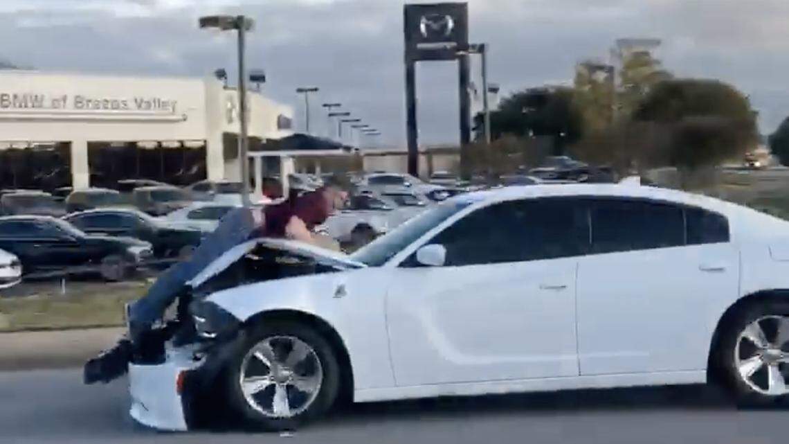 A College Station, Texas, man rear-ended a pickup and then fled the crash site with the pickup driver clinging to the hood of his vehicle, video shows. He’s charged with aggravated assault and driving intoxicated.