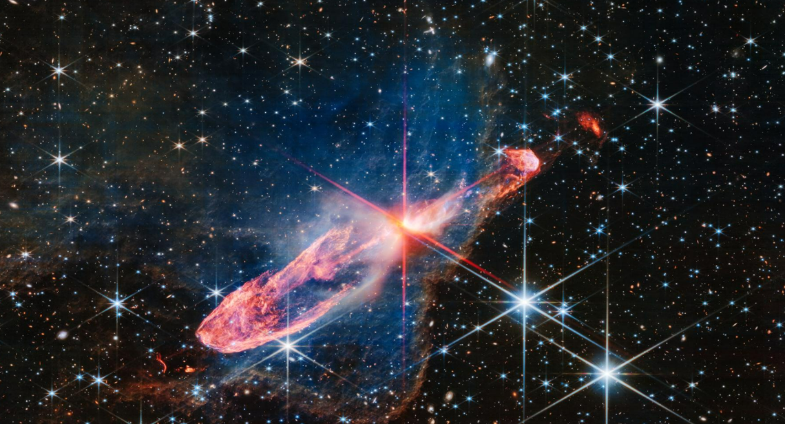 The photo depicts several nascent stars known as Herbig-Haro 46/47.