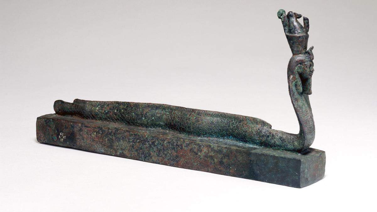 Two coffins were topped with a representation of creator god Atum, part eel, part cobra and part human.