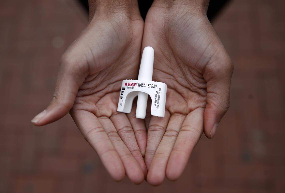 In this Jan. 23, 2018 photo, Leah Hill, a behavioral health fellow with the Baltimore City Health Department, displays a sample of Narcan nasal spray in Baltimore. The overdose-reversal drug is a critical tool to easing America’s coast-to-coast opioid epidemic. But not everyone on the front lines has all they need. Baltimore’s health department is rationing its supplies of naloxone because it says it can’t afford an adequate stockpile. (AP Photo/Patrick Semansky)