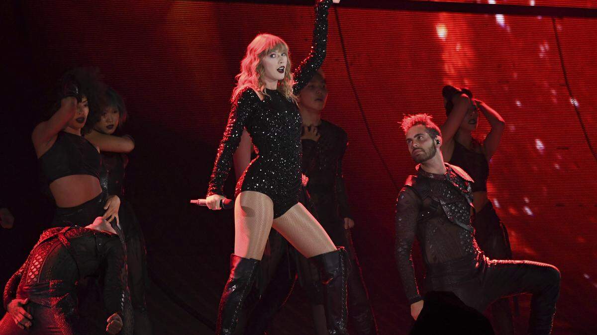 Singer Taylor Swift performs during her Reputation tour at MetLife Stadium in New Jersey in July. Swift will sing as the opener at the American Music Awards Tuesday after posting on Instagram that she would be voting for Democrats in the midterm elections in Tennessee.