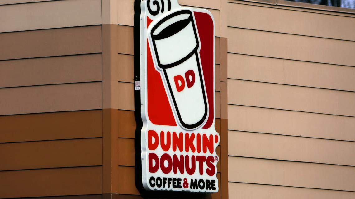 This is the Dunkin’ Donuts log on a shop in Mount Lebanon, Pa. Monday, Jan. 22, 2018. Twelve Dunkin’ franchise locations and nine McDonald’s franchise locations across New Hampshire and Vermont violated child labor laws in 2022, according to the Department of Labor. (AP Photo/Gene J. Puskar)