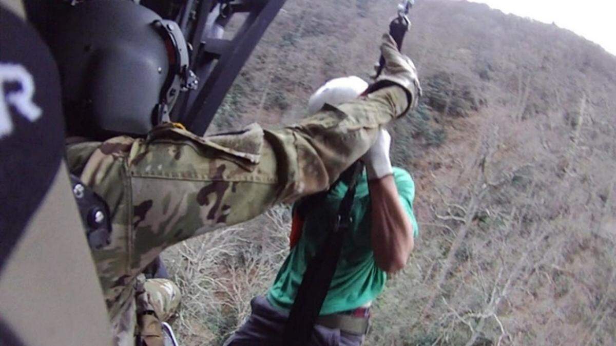 Rescuers airlifted two hikers to safety after they became stranded on the Appalachian Trail in the dark.
