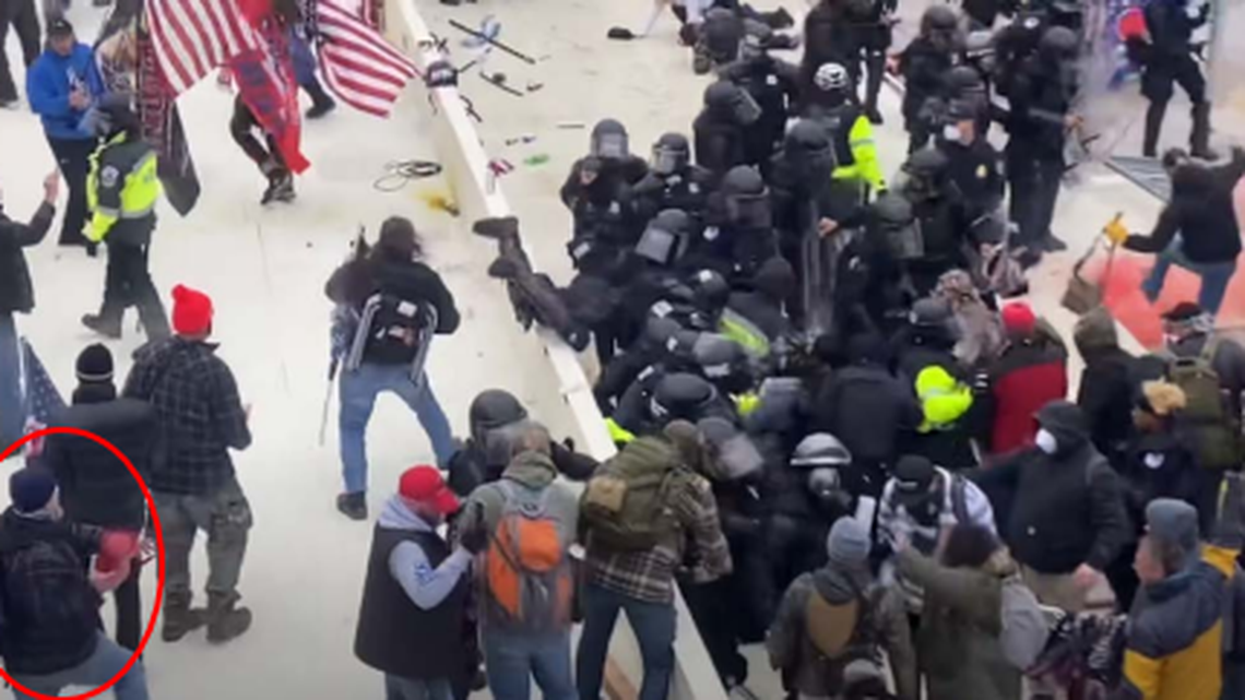 Retired Chester, Pennsylvania, firefighter Robert Sanford threw a fire extinguisher at U.S. Capitol police officers, the FBI says. Screengrab from FBI.