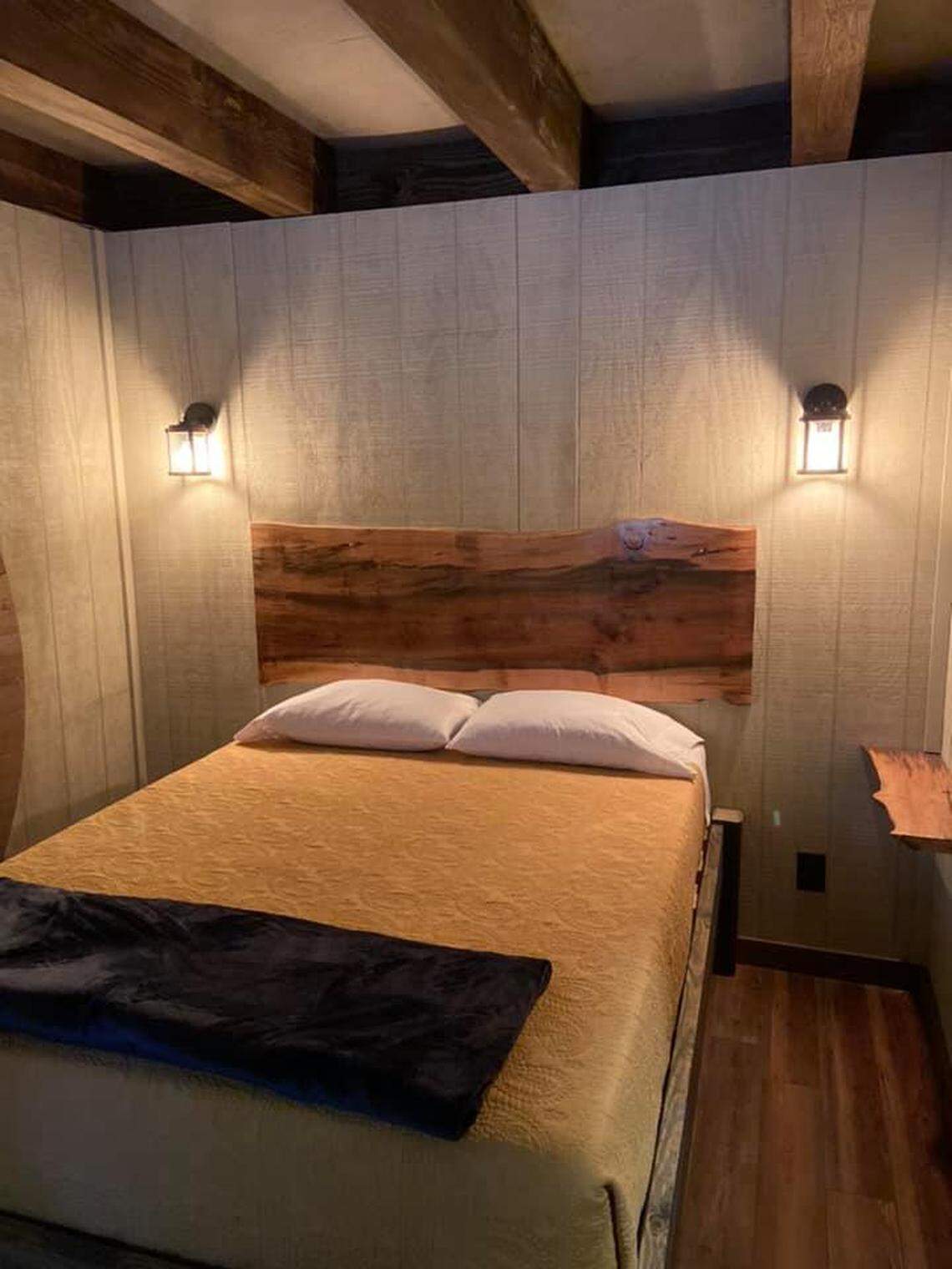 The “main” entrance opens into a bedroom with a queen-sized bed.