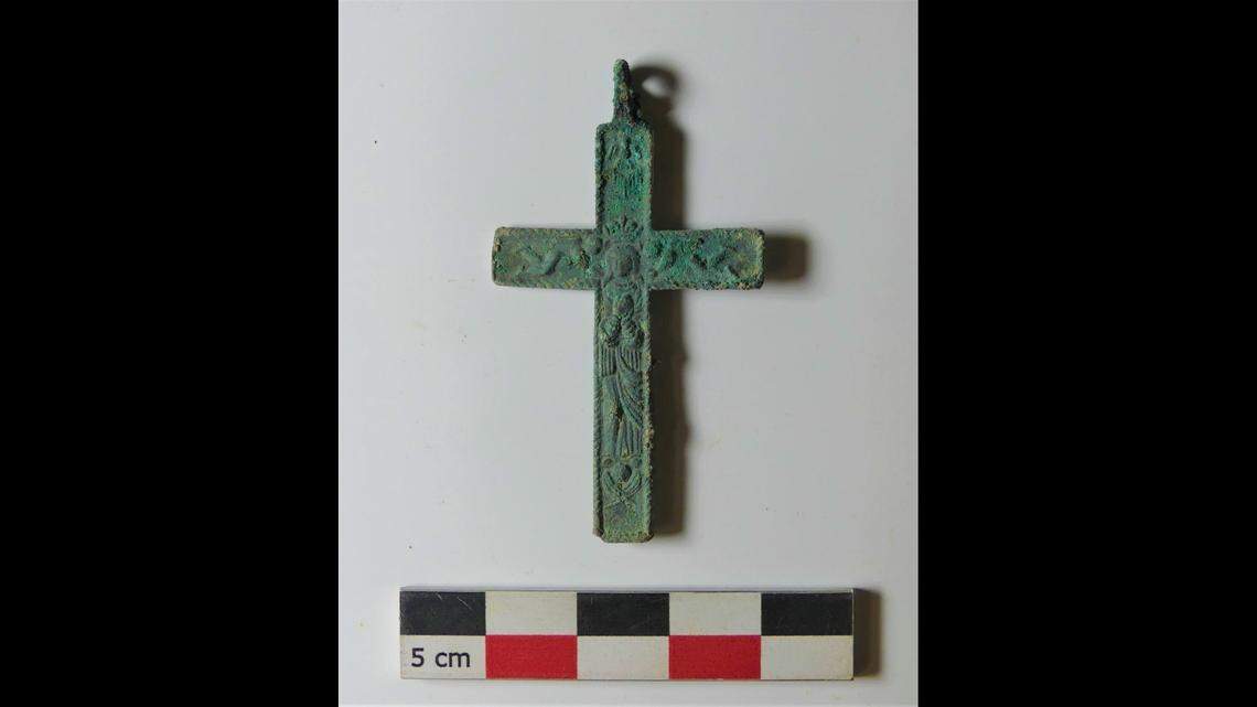 A cross pendant found among the ancient burials.