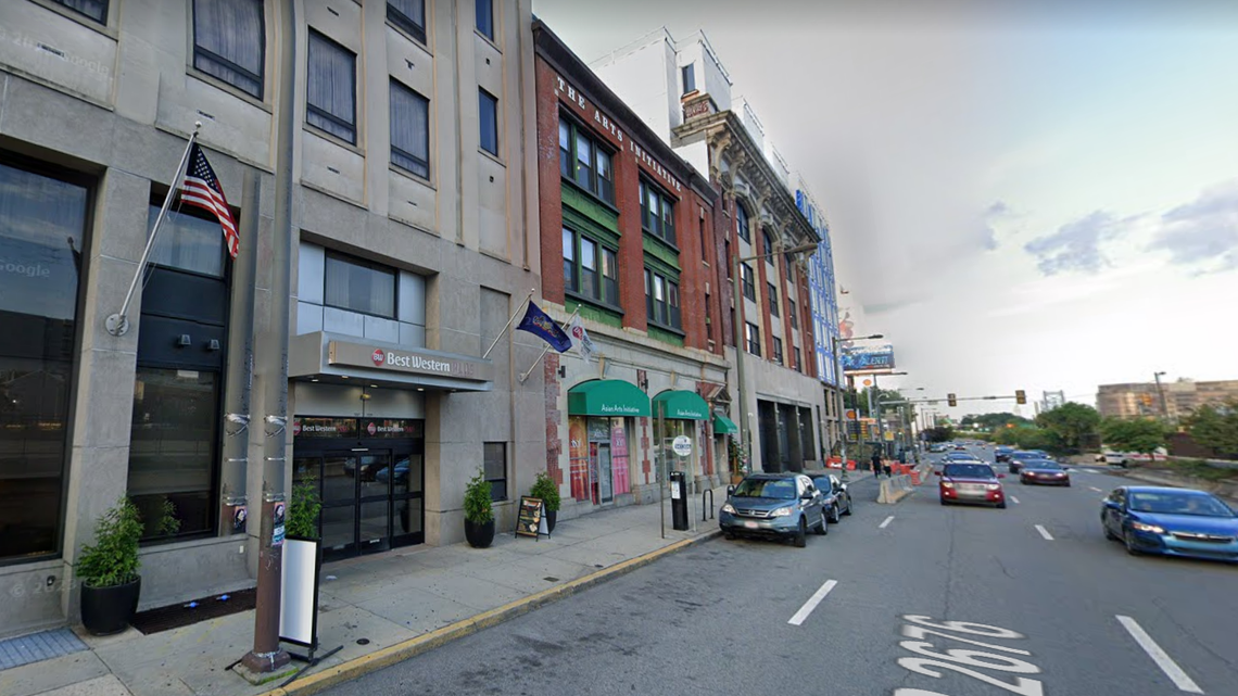 A man accused of sexual assault was found bloody in a hotel lobby alongside a woman with a machete, police said.