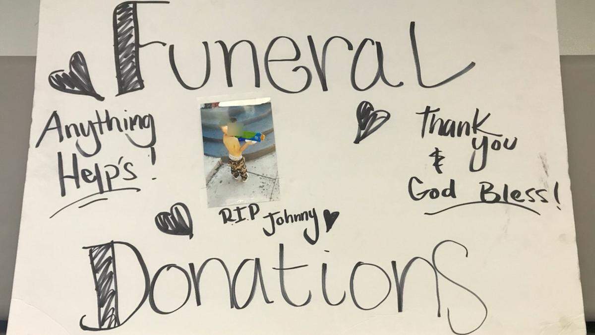 All three men were holding signs claiming to seek donations for the child, who was actually alive, police said.