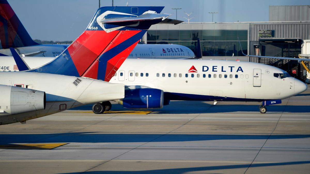 A flight to Los Angeles from Washington, D.C., was diverted to Oklahoma City after a passenger assaulted a flight attendant and air marshal, police said.