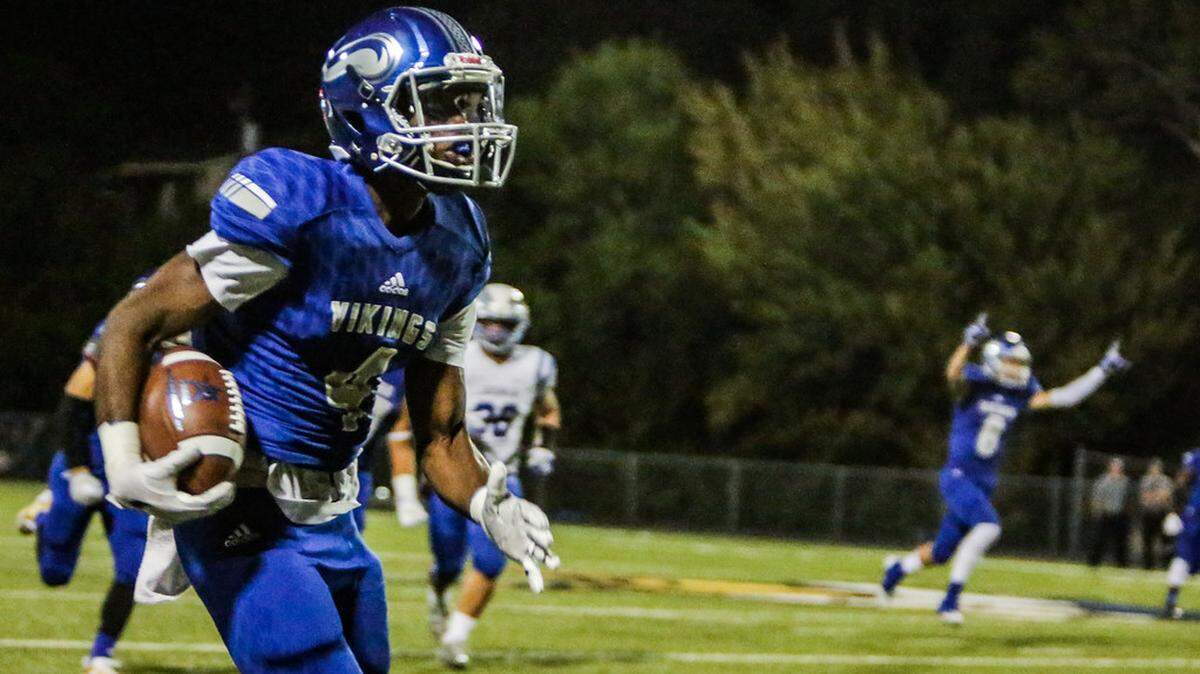 Brandon Reed takes an interception back for a touchdown against Joshua during the 2017 football season.