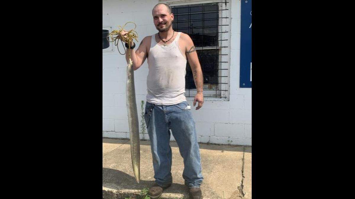 Carlin Allison of Doniphan, Missouri, caught a state-record eel in the Current River that weighed 6 pounds, 15 ounces. Photo from Carlin Allison via the Missouri Department of Conservation.