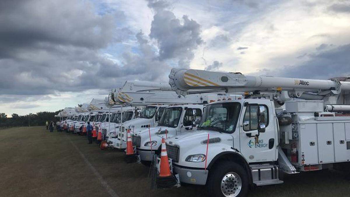 Duke Energy trucks lined up and prepared for a storm in advance of a hurricane in this file photo.