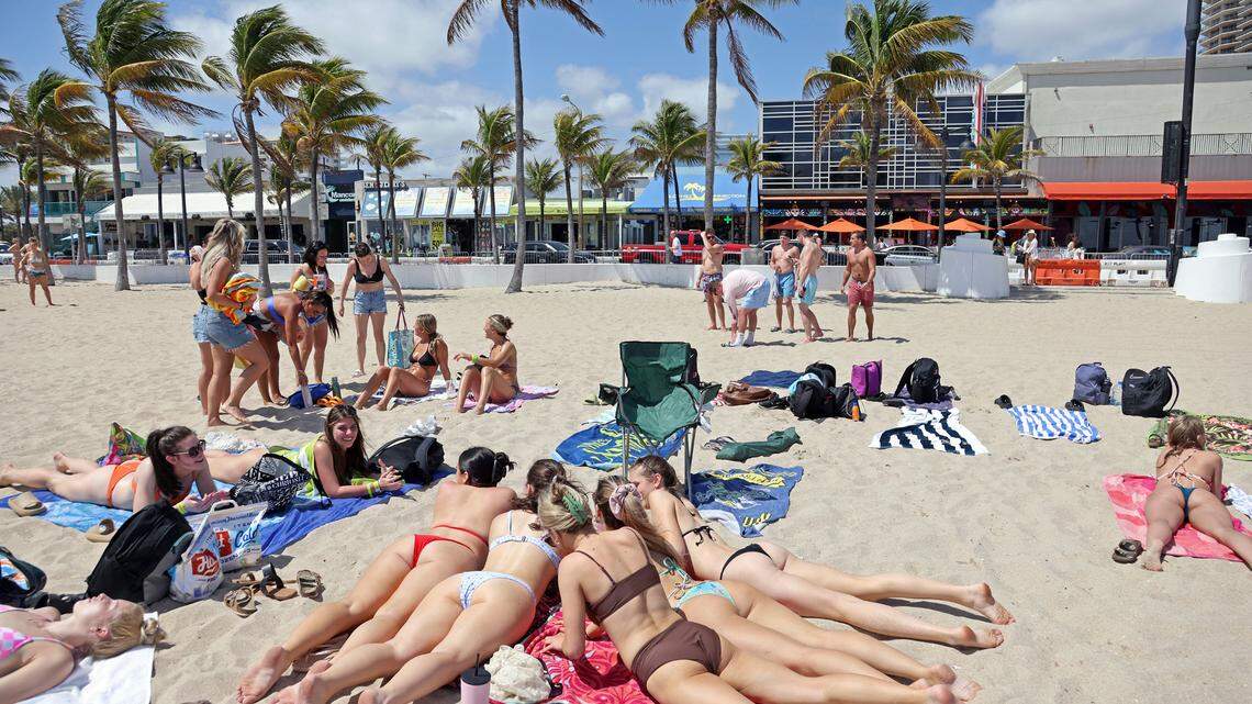 Beach goers share a blanket during Spring Break on Fort Lauderdale Beach, Fla., Tuesday, March 22, 2022. (Amy Beth Bennett/South Florida Sun-Sentinel via AP) A new Yelp ranking lists Santa Barbara, California, among the top spring break destinations in 2022. Other top destinations include Florida, Wyoming and Arizona.