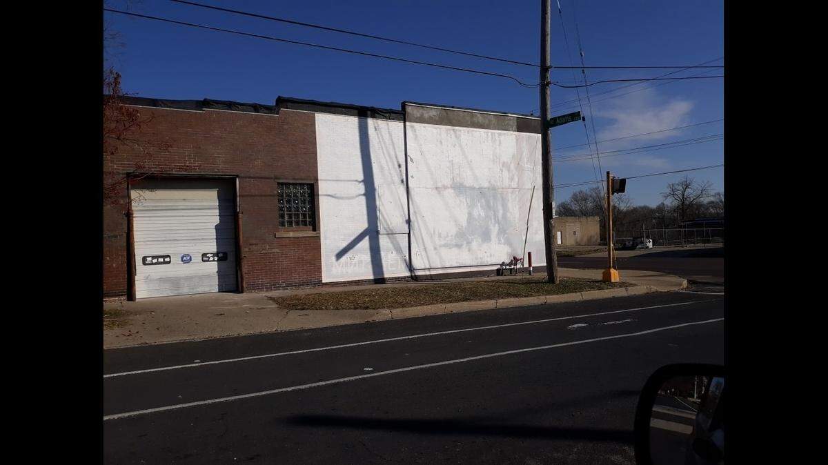 A Cookie Monster mural painted on a Peoria, Illinois, building was painted white because the property owner didn’t give permission for the painting. Photo from Joshua Hawkins.