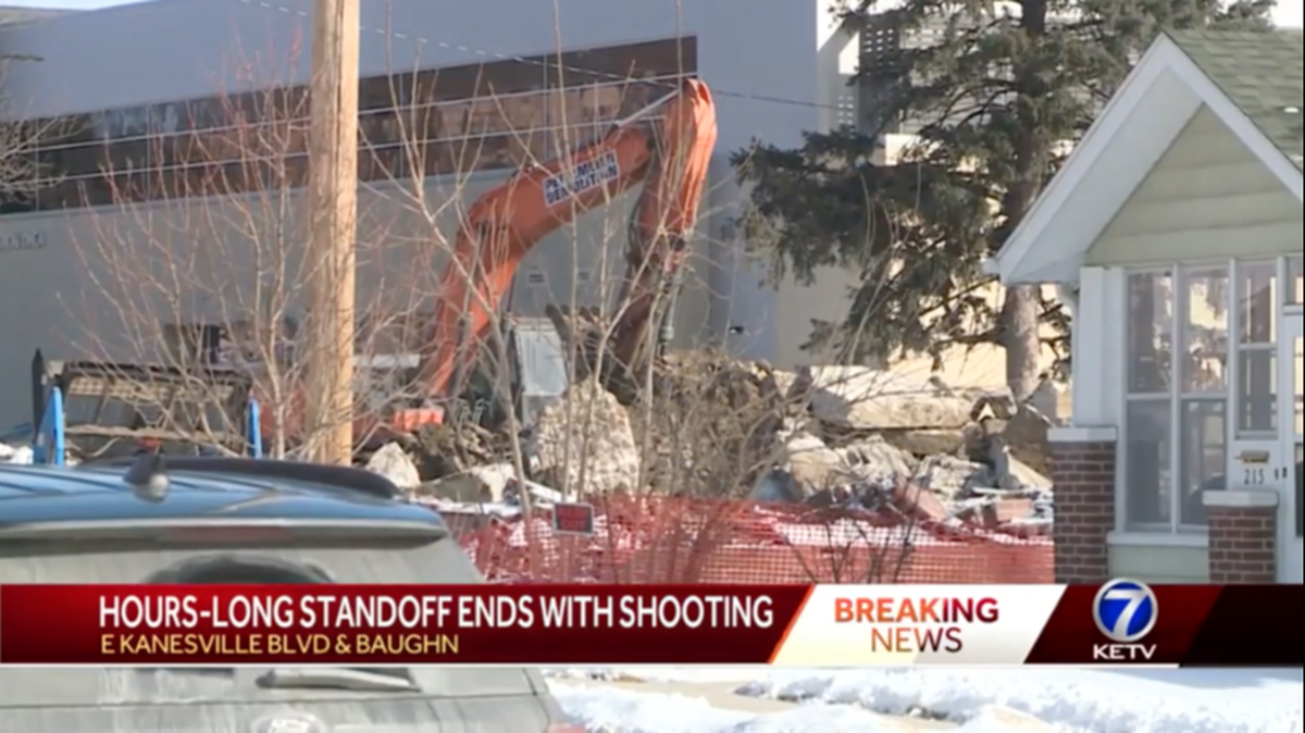 Ryan Linehan, who was wanted on a sexual assault charge, shot himself and swung an excavator bucket at officers during a standoff in Council Bluffs, Iowa, police say. Screengrab from KETV