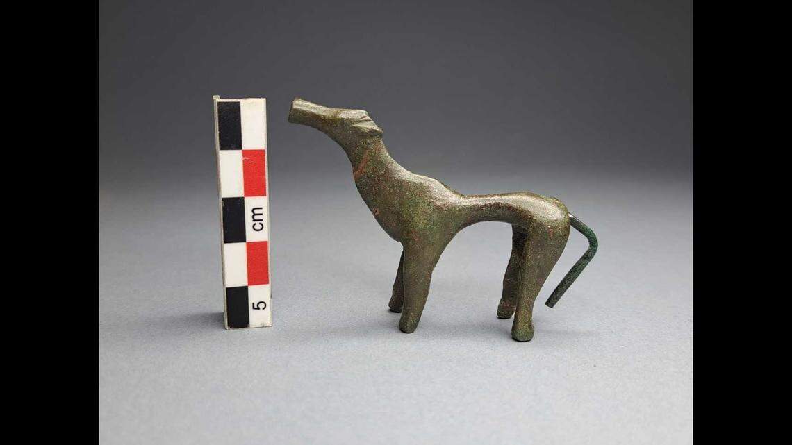 Experts believe one of the bronze figurines was a dog.