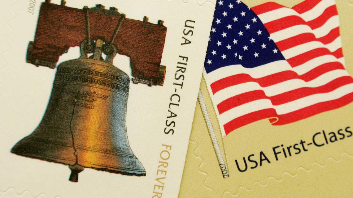A Colorado woman accused of stealing $258,452 from the Postal Service by purchasing stamps in bulk with counterfeit checks has been sentenced to prison. (AP Photo/Steven Senne)