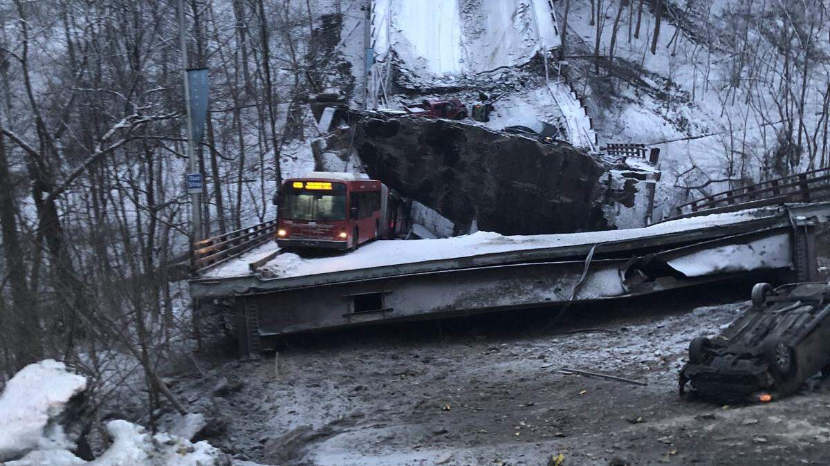 A bus carrying two people and a driver was stuck when a snow-covered bridge collapsed in Pittsburgh.