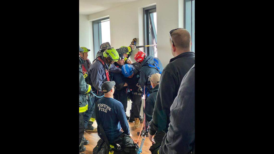 Two window washers were rescued by the Boston Fire Department after their equipment failed.