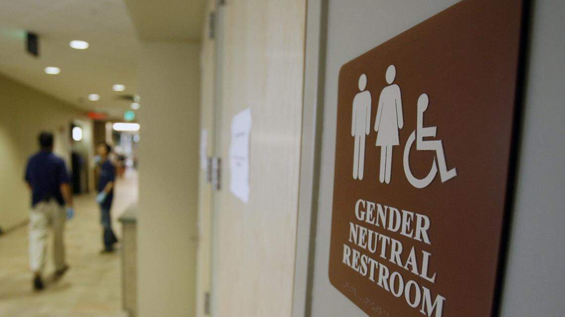 A sign marks the entrance to a gender-neutral restroom at the University of Vermont in Burlington, Vt.