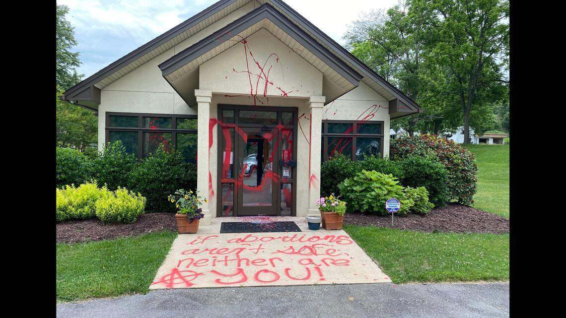 Vandals sprayed threatening graffiti, broke windows and left a bloody trail at a pregnancy clinic, North Carolina police say.