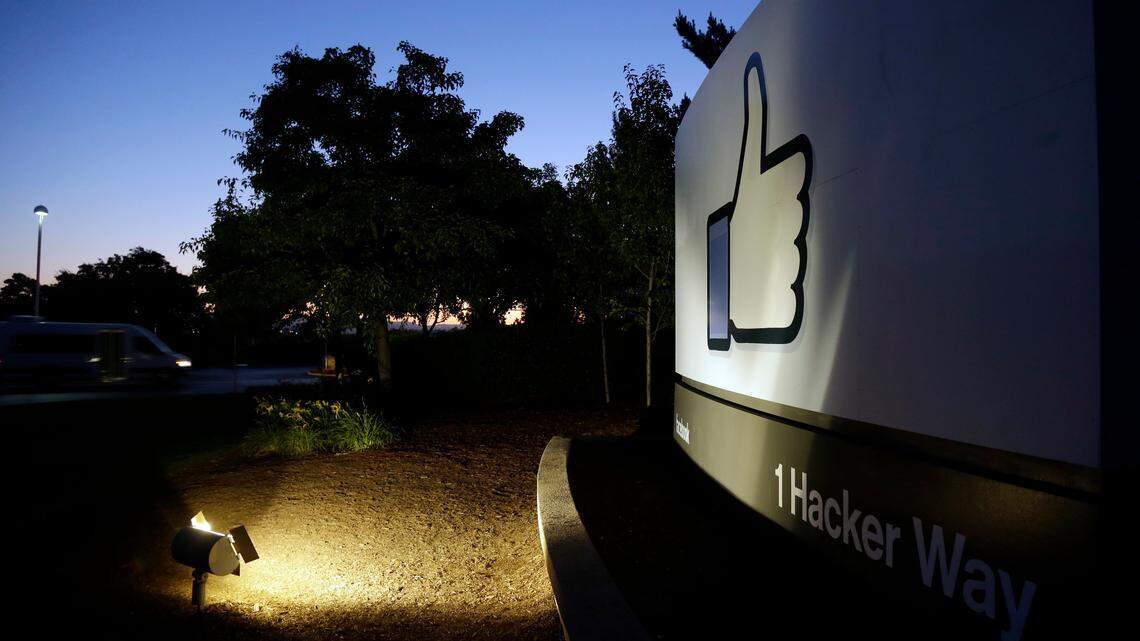 The Facebook “like” symbol is illuminated on a sign outside the company’s headquarters in Menlo Park, California. A Facebook contractor who moderated graphic, violent posts says her job gave her post-traumatic stress disorder and that Facebook did little to protect her, according to a lawsuit filed in San Mateo.