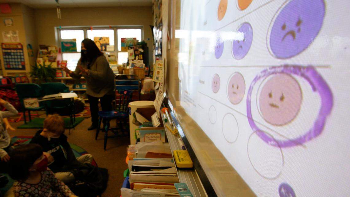 Grade school teacher Melissa Shugg teaches a lesson at Paw Paw Elementary School about thoughts, feelings and actions on Dec. 2, 2021, in Paw Paw, Michigan. The U.S. Preventive Task Force recommended that all children ages 8 and up receive screenings for anxiety, saying that early screening can help the adults around them get them the resources to help.