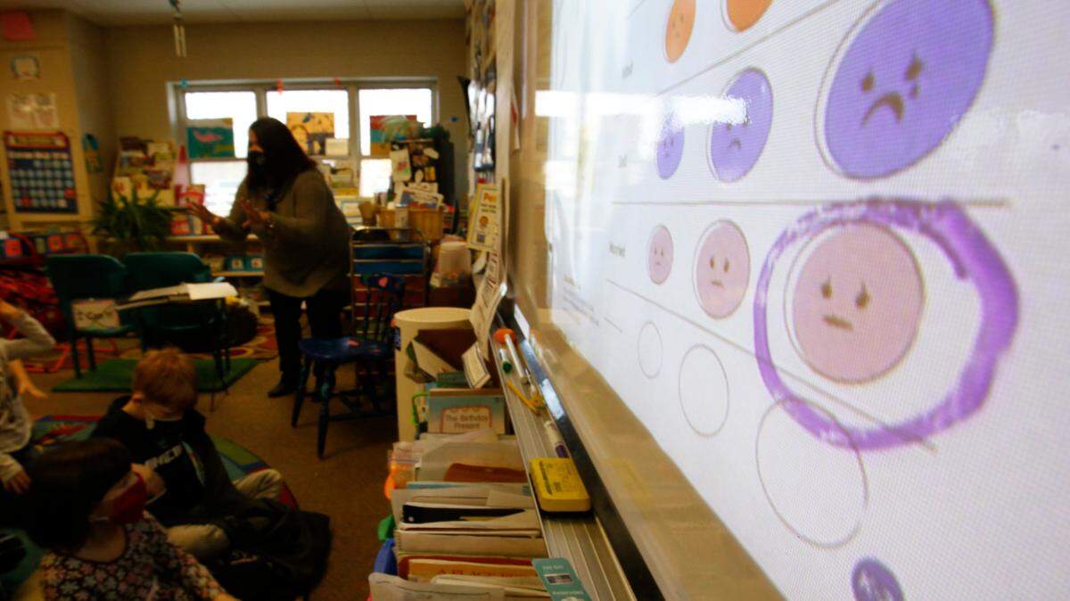 Grade school teacher Melissa Shugg teaches a lesson at Paw Paw Elementary School about thoughts, feelings and actions on Dec. 2, 2021, in Paw Paw, Michigan. The U.S. Preventive Task Force recommended that all children ages 8 and up receive screenings for anxiety, saying that early screening can help the adults around them get them the resources to help.