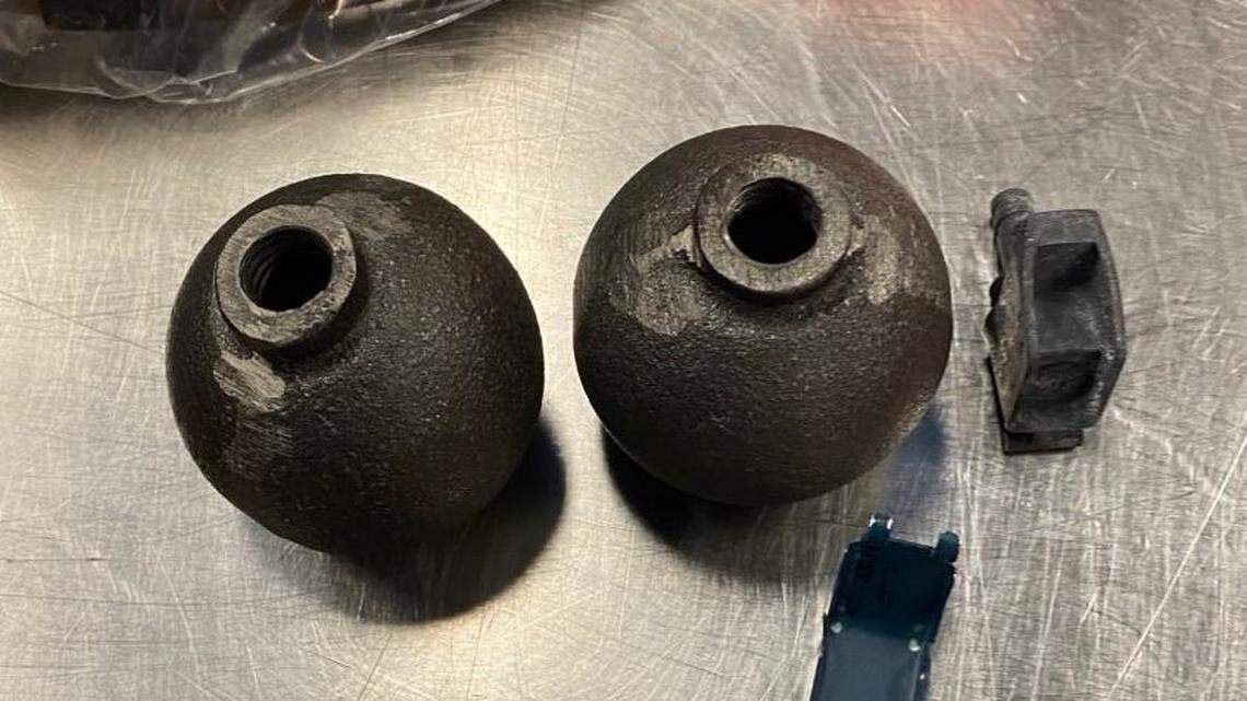 Officials at the Seattle-Tacoma International Airport found two inert grenades in a traveler’s checked luggage and evacuated the screening area for explosives.