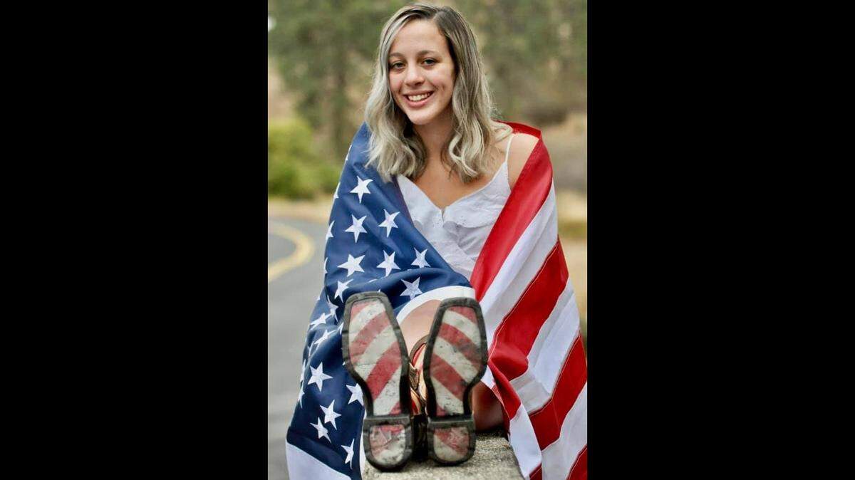 A senior at Lewis and Clark High School in Spokane, WA says her yearbook photo was denied because she used the US flag. The school says that’s not quite the case.