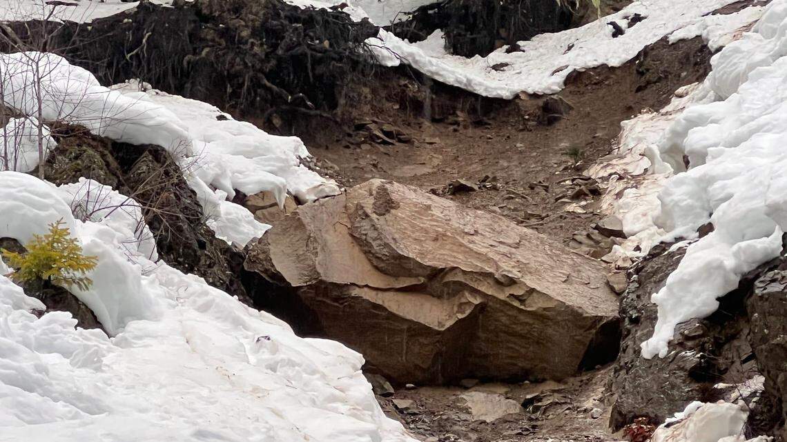 Washington officials say a large boulder threatens to fall onto White Pass, prompting them to close the road.