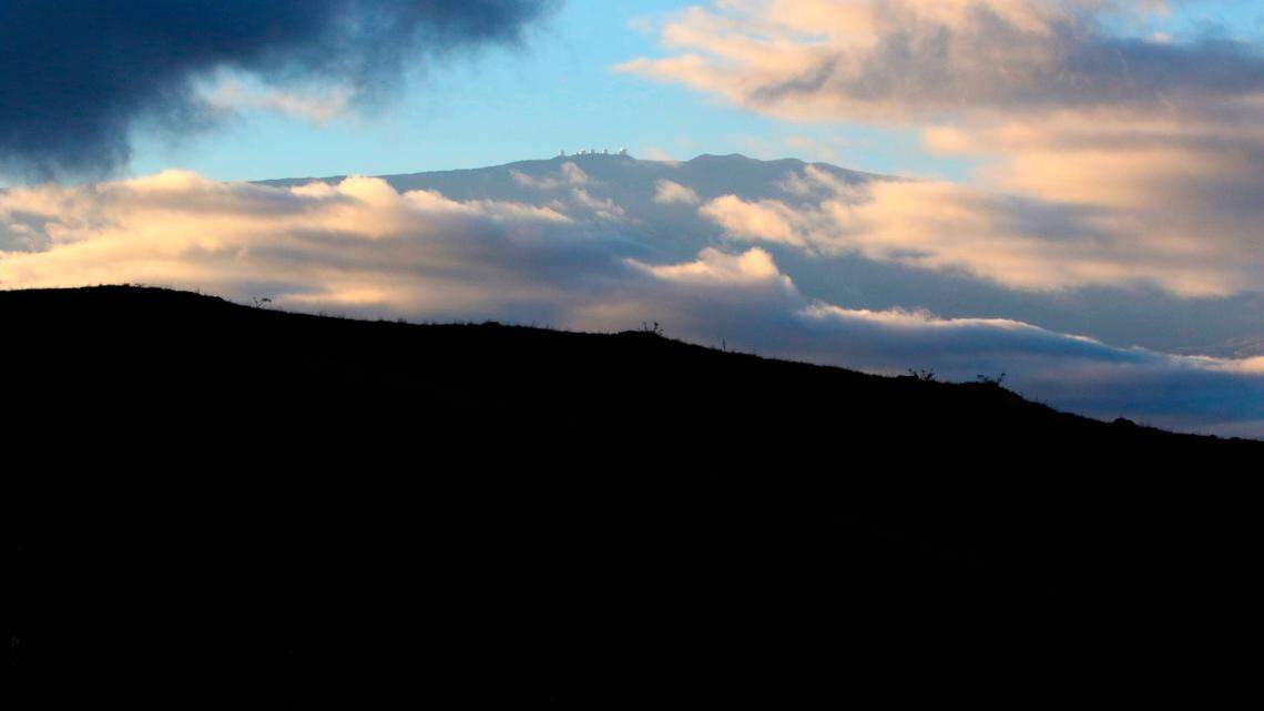 Hawaii’s Mauna Kea is shown on Friday, Aug. 6, 2021. On Jan. 1, a 9-year-old girl was killed and seven people were injured when a truck veered off the road and fell into a ravine near Mauna Kea. (AP Photo/Caleb Jones)