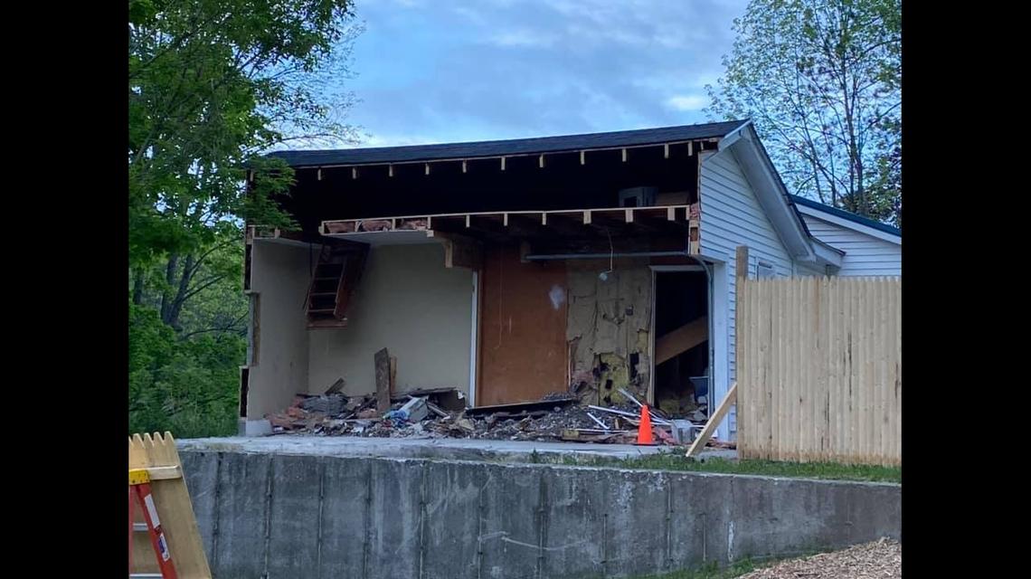 Debris from the cutting was piled back into the garage after it was cut in half. Photo from Gabriel Brawn on Facebook.