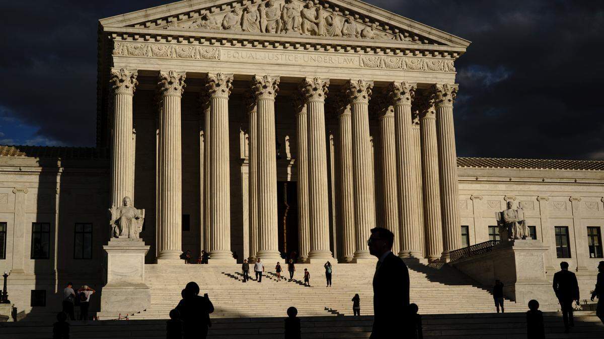 FILE - The U.S Supreme Court building is seen at dusk in Washington on Oct. 22, 2021. Democrats across the political spectrum embraced the news of 83-year-old liberal Justice Stephen Breyer’s looming retirement, which gives President Joe Biden an opportunity to deliver on a pledge to appoint the first Black woman to the Supreme Court. (AP Photo/J. Scott Applewhite, File)