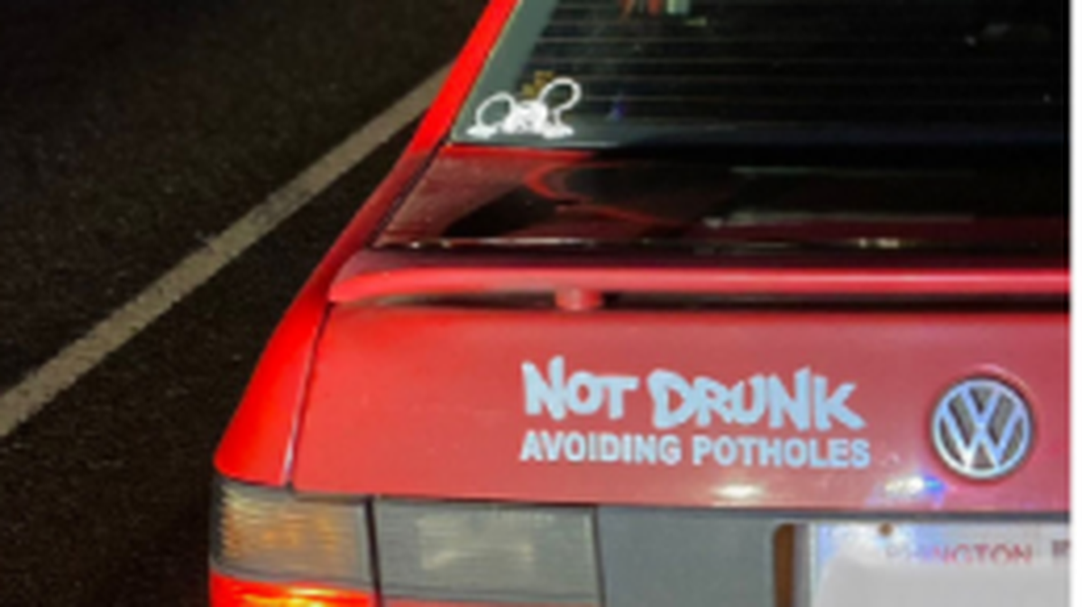 Oregon police pulled over a car with a “not drunk” bumper sticker after the driver was going between 80 and 90 mph and found empty beer cans and cocaine, cops say.