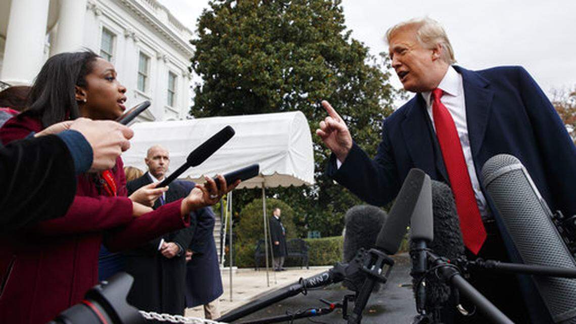 CNN journalist Abby Phillip asks President Donald Trump a question as he speaks with reporters before departing for France on the South Lawn of the White House, Friday, Nov. 9, 2018, in Washington. (AP Photo/Evan Vucci)